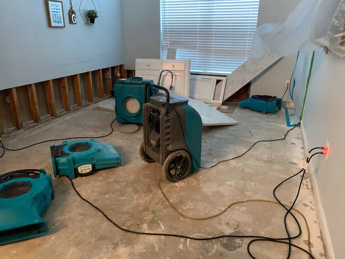 Dehumidifier in flood-cut room for Water Damage Restoration in Gardiner