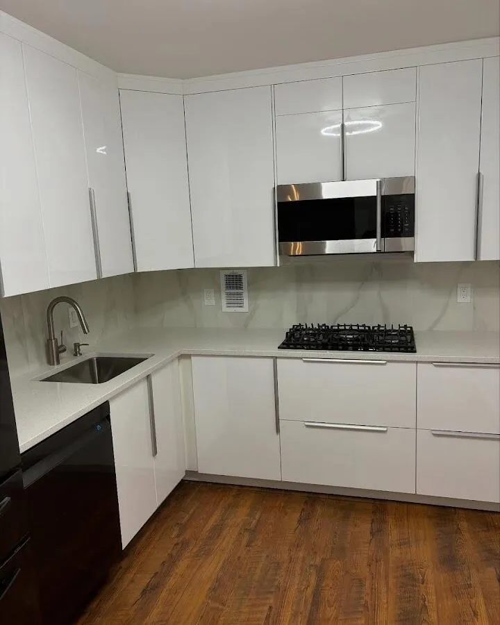 Restored kitchen with white cabinets after water damage in Gardiner